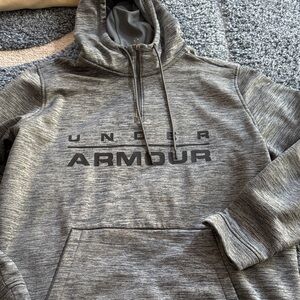 Gently Used..Under Armour Charcoal Men's Hoodie with rear drop hem